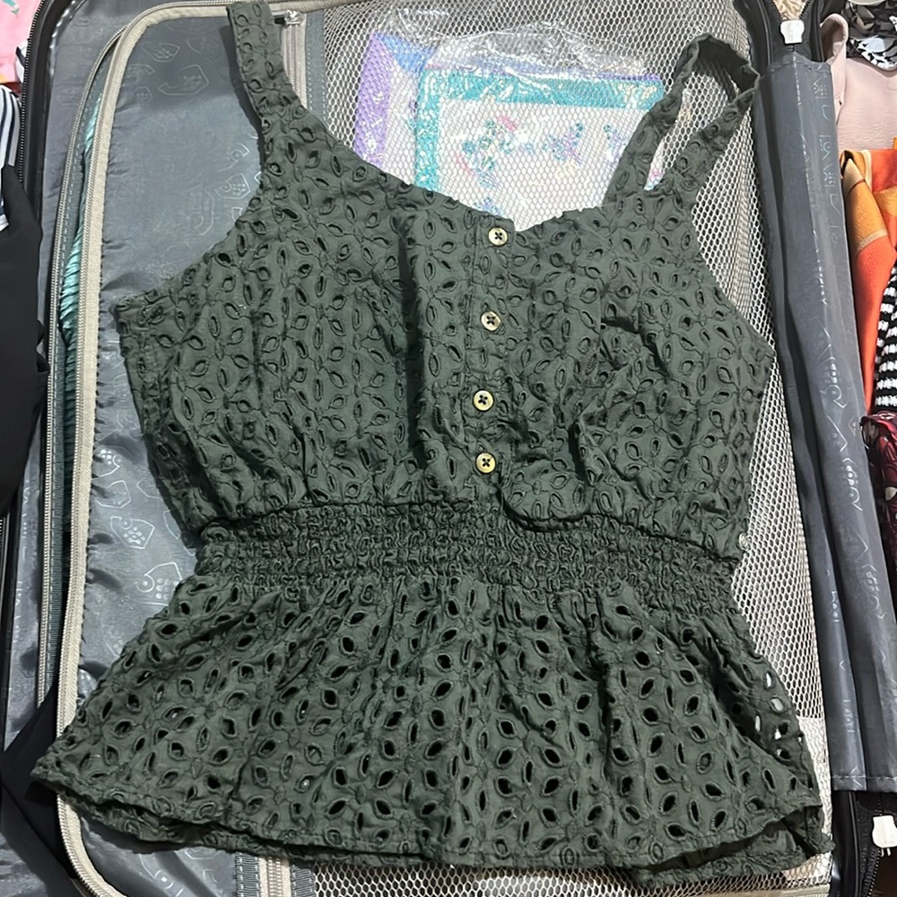 Olive green crop top. 100% cotton. Elastic at waist gives good shape